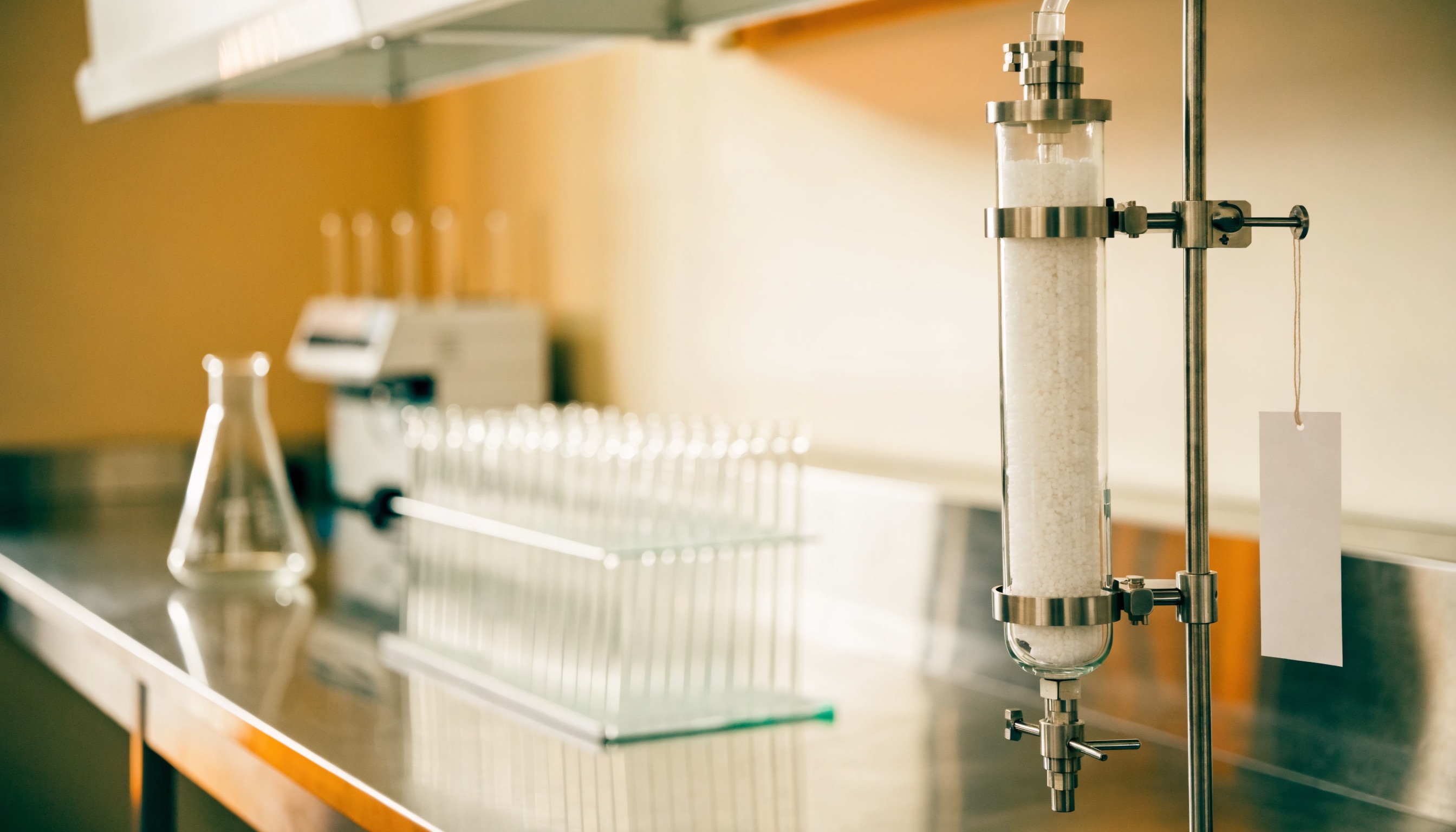 A short row of named laboratory instruments on a bench, each labelled and accounted for: a finite account universe where every buyer can be named.